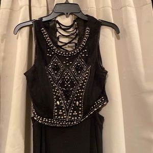 2-piece crop top with long skirt Left side slit on skirt.  Criss cross backing